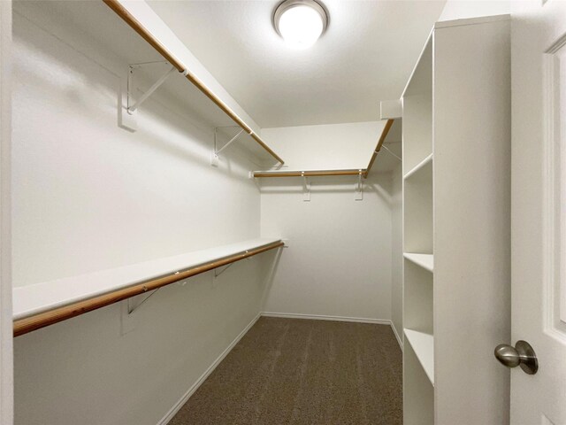 603 Jamie Ln, Mansfield, TX 76063 - spacious closet featuring dark colored carpet