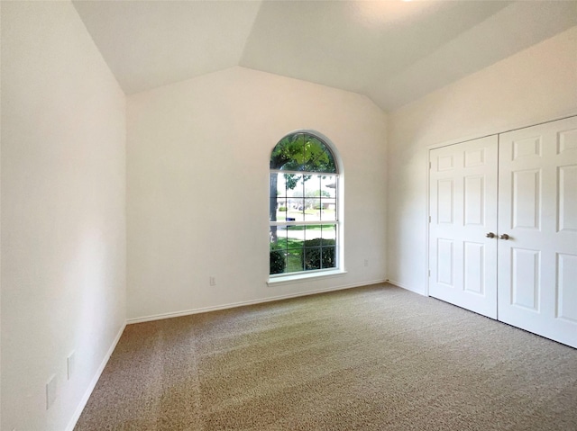 603 Jamie Ln, Mansfield, TX 76063 - unfurnished bedroom with carpet floors, vaulted ceiling, a closet, and baseboards