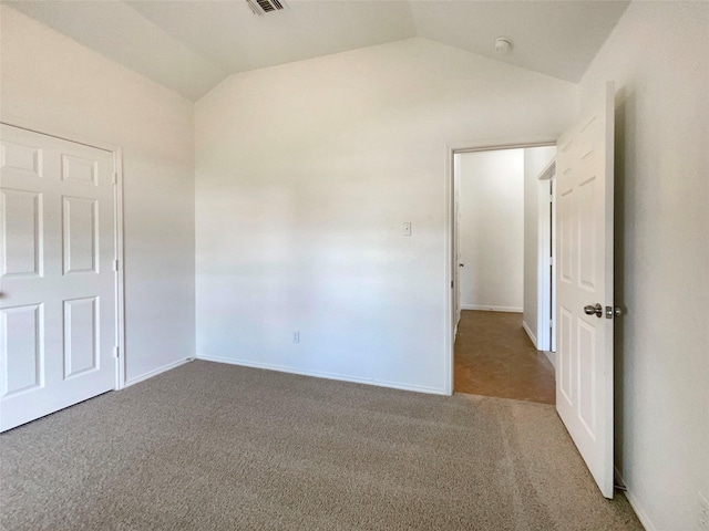 603 Jamie Ln, Mansfield, TX 76063 - unfurnished bedroom featuring lofted ceiling, carpet, and baseboards