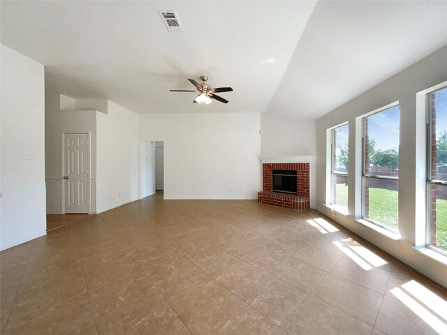 603 Jamie Ln, Mansfield, TX 76063 - unfurnished living room with vaulted ceiling, a fireplace, ceiling fan, and tile patterned flooring
