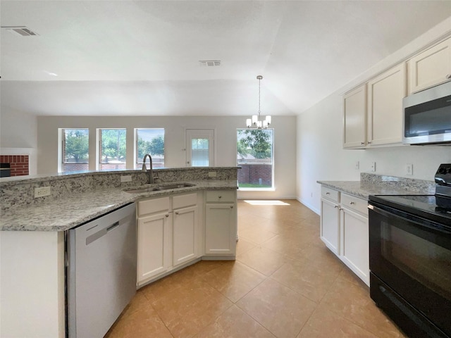 603 Jamie Ln, Mansfield, TX 76063 - kitchen featuring stainless steel appliances, a sink, lofted ceiling, a chandelier, and light tile patterned flooring