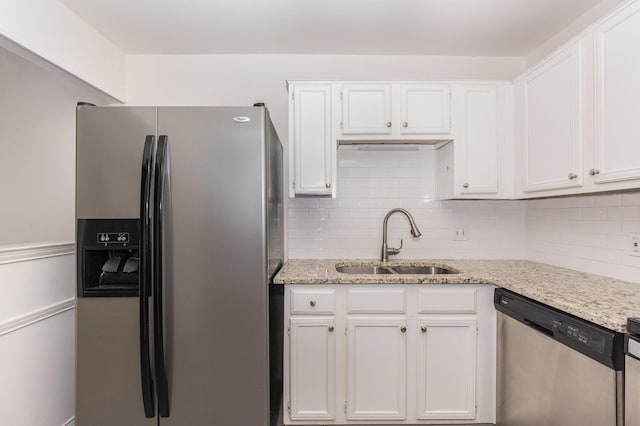 8750 Park Ln Unit 151, Dallas, TX 75231 - kitchen with appliances with stainless steel finishes, a sink, and white cabinetry