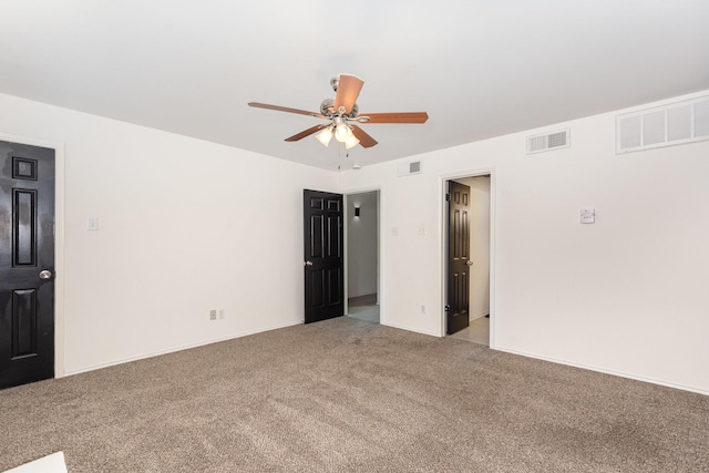 8750 Park Ln Unit 151, Dallas, TX 75231 - empty room featuring light carpet, a ceiling fan, and baseboards