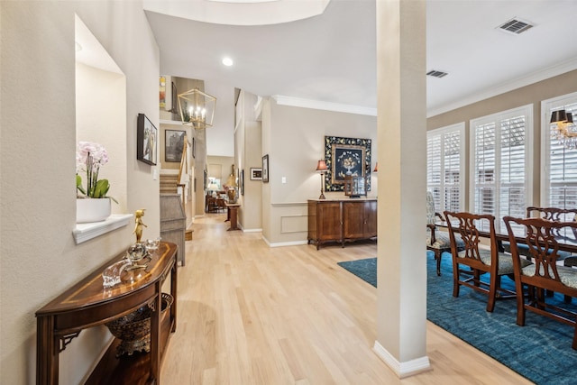 7904 Briar Brook Ct, Dallas, TX 75218 - hallway with wood finished floors, a chandelier, and ornamental molding