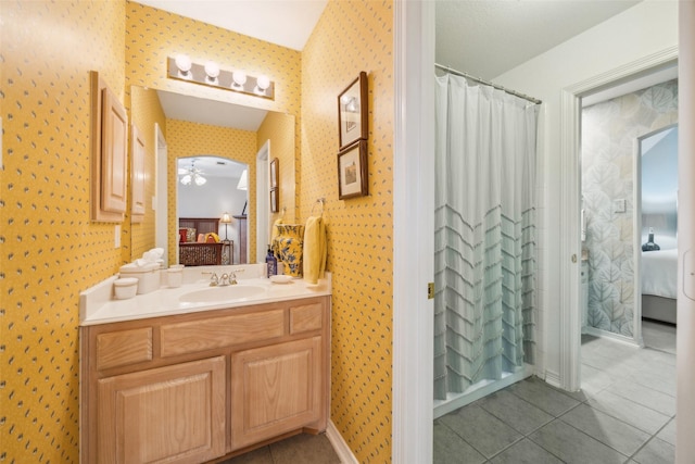 7904 Briar Brook Ct, Dallas, TX 75218 - full bathroom with ensuite bathroom, wallpapered walls, tile patterned flooring, a ceiling fan, and vanity
