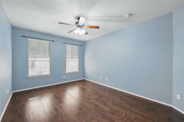 1632 Degnen Ln, Providence Village, TX 76227 - spare room with a ceiling fan, baseboards, and dark wood-style flooring