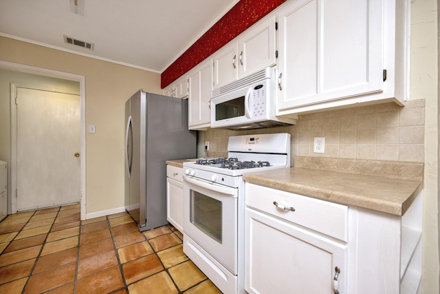 320 Gloria St, Keller, TX 76248 - kitchen featuring white appliances, white cabinets, backsplash, light countertops, and ornamental molding