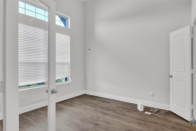 2917 Bobcat Dr, Melissa, TX 75454 - empty room featuring baseboards and dark wood-type flooring