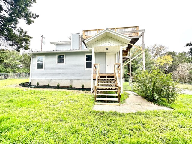 177 Catfish Trl, Whitney, TX 76692 - view of front of property with stairs, metal roof, and a wooden deck