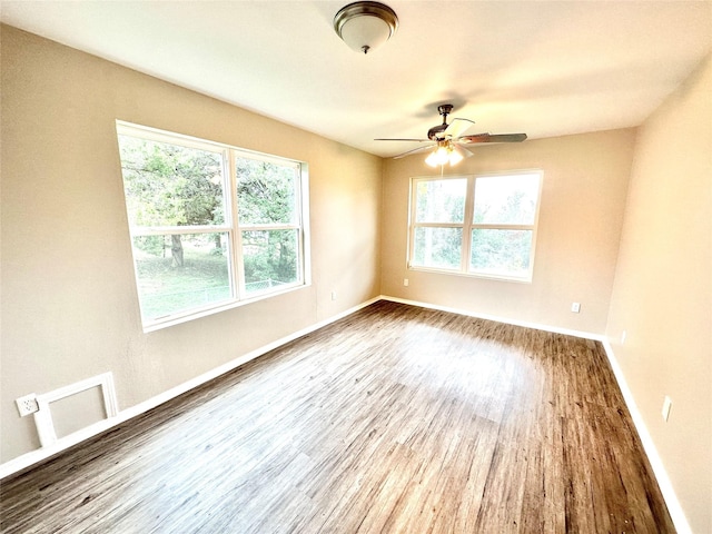 177 Catfish Trl, Whitney, TX 76692 - empty room featuring wood finished floors, a ceiling fan, and baseboards