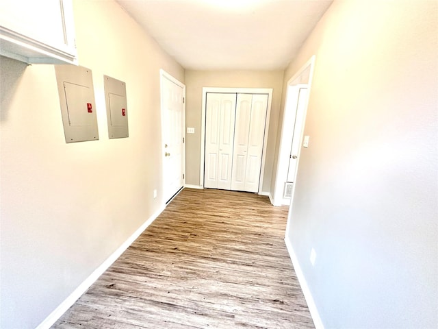 177 Catfish Trl, Whitney, TX 76692 - hallway with electric panel, light wood-type flooring, and baseboards