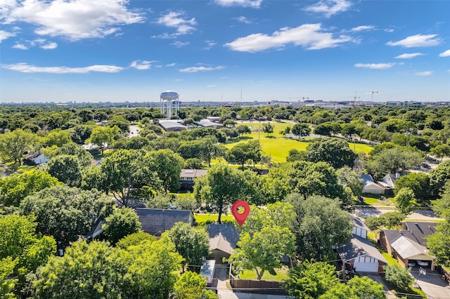 drone / aerial view of a tree filled landscape