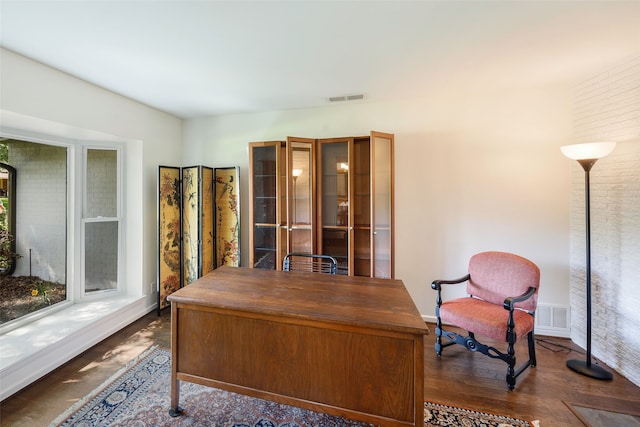 office area featuring baseboards and dark wood finished floors