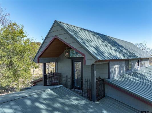 1847 N State Highway 19, Emory, TX 75440 - view of front facade featuring metal roof and a deck