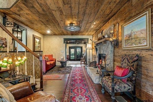 1847 N State Highway 19, Emory, TX 75440 - living area featuring wood ceiling, wood finished floors, stairway, a stone fireplace, and a ceiling fan