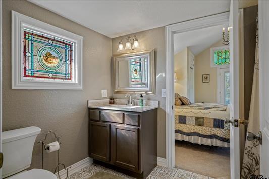 1847 N State Highway 19, Emory, TX 75440 - ensuite bathroom with toilet, vanity, and baseboards