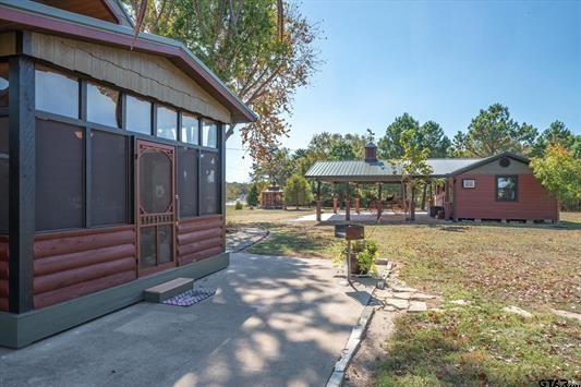 1847 N State Highway 19, Emory, TX 75440 - view of property exterior with a gazebo, a sunroom, and a patio area
