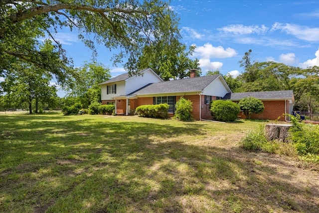 13591 County Road 420, Tyler, TX 75704 - view of front facade with brick siding, a chimney, and a front yard