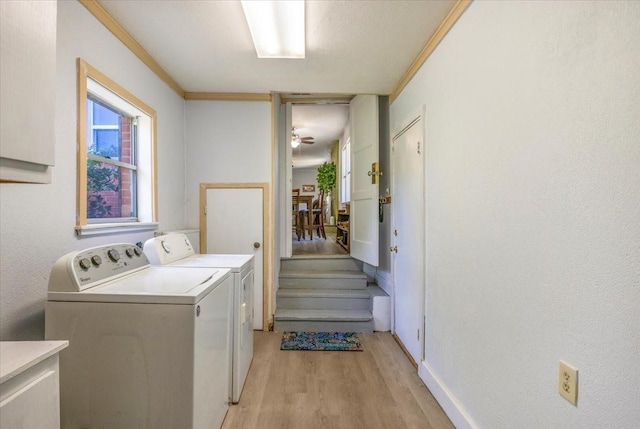 13591 County Road 420, Tyler, TX 75704 - laundry room with independent washer and dryer, light wood finished floors, baseboards, ornamental molding, and ceiling fan