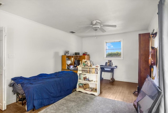 13591 County Road 420, Tyler, TX 75704 - bedroom featuring hardwood / wood-style floors, baseboards, crown molding, and ceiling fan