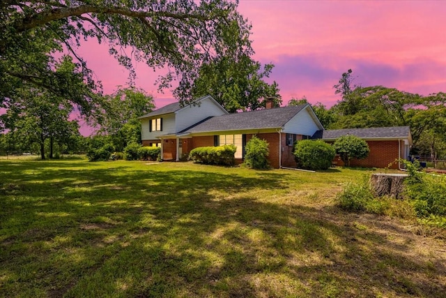 13591 County Road 420, Tyler, TX 75704 - view of front of house featuring brick siding, a chimney, and a lawn