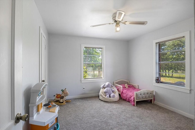 13591 County Road 420, Tyler, TX 75704 - carpeted bedroom with baseboards and a ceiling fan