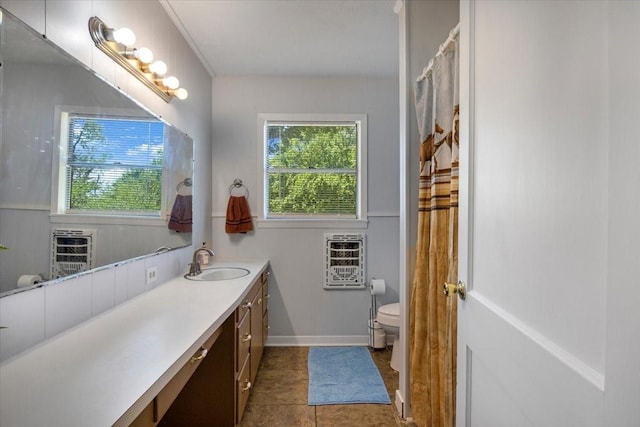 13591 County Road 420, Tyler, TX 75704 - bathroom with heating unit, healthy amount of natural light, vanity, and toilet