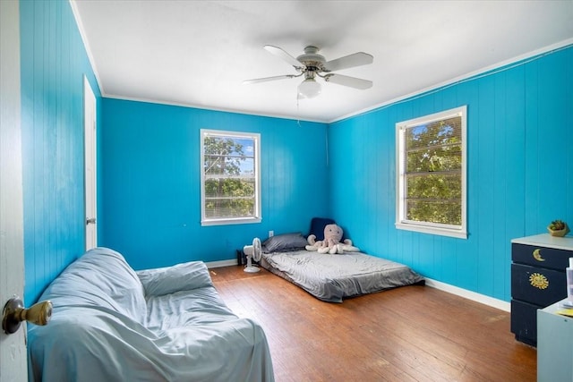 13591 County Road 420, Tyler, TX 75704 - bedroom featuring wood finished floors, ornamental molding, a ceiling fan, and baseboards
