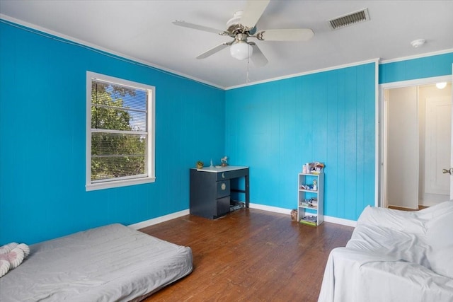 13591 County Road 420, Tyler, TX 75704 - bedroom with wood finished floors, ornamental molding, baseboards, and ceiling fan