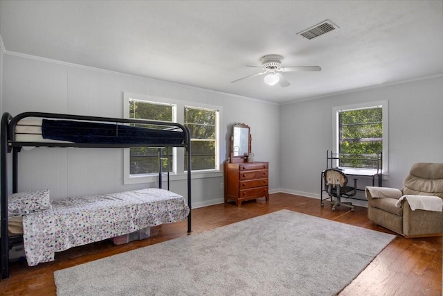 13591 County Road 420, Tyler, TX 75704 - bedroom featuring wood finished floors, ornamental molding, a ceiling fan, and baseboards