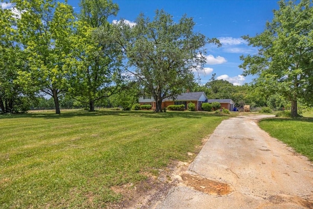13591 County Road 420, Tyler, TX 75704 - view of green lawn featuring driveway