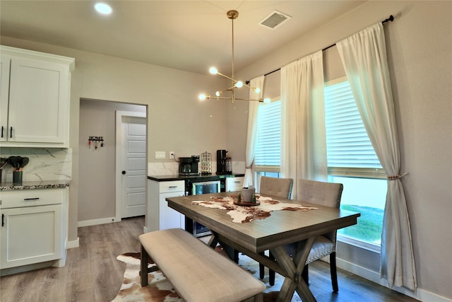 130 County Road 2630, Decatur, TX 76234 - dining area featuring light wood-style flooring, a chandelier, and baseboards