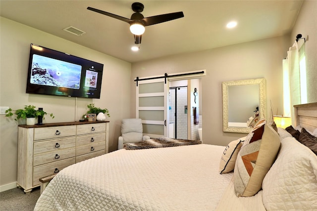 130 County Road 2630, Decatur, TX 76234 - bedroom featuring a barn door, dark colored carpet, and a ceiling fan