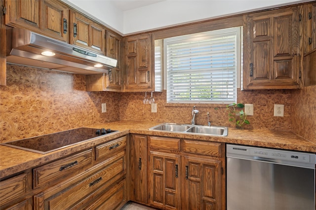 1706 Morningstar Trl, Richardson, TX 75081 - kitchen with stainless steel dishwasher, under cabinet range hood, black electric cooktop, a sink, and brown cabinetry