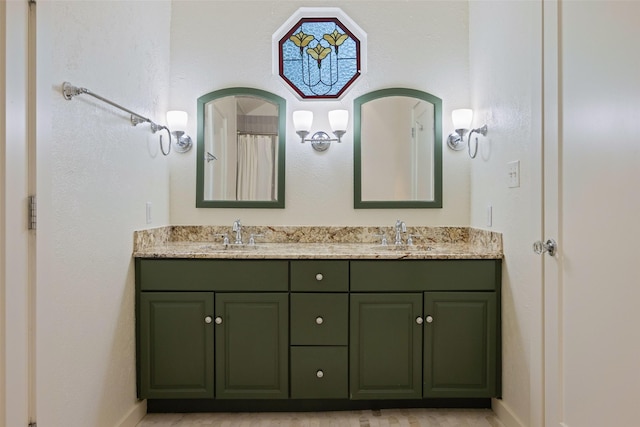 1143 N Winnetka Ave, Dallas, TX 75208 - bathroom featuring double vanity and baseboards