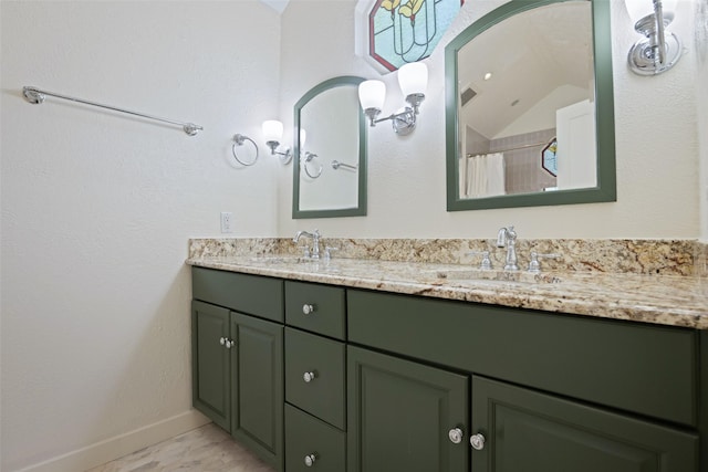 1143 N Winnetka Ave, Dallas, TX 75208 - bathroom with double vanity and baseboards