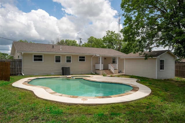 2513 First St, Caddo Mills, TX 75135 - view of swimming pool featuring central AC unit and a pool with connected hot tub