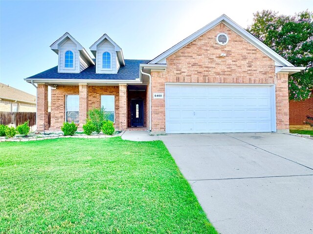6468 Payton Dr, Fort Worth, TX 76131 - view of front of home featuring brick siding, concrete driveway, and a garage