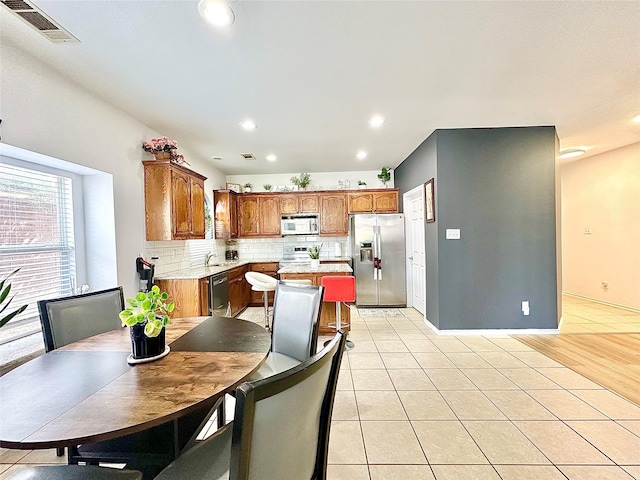 6468 Payton Dr, Fort Worth, TX 76131 - dining room with recessed lighting and light tile patterned floors