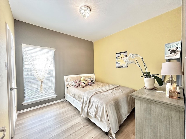 6468 Payton Dr, Fort Worth, TX 76131 - bedroom with wood finished floors and baseboards