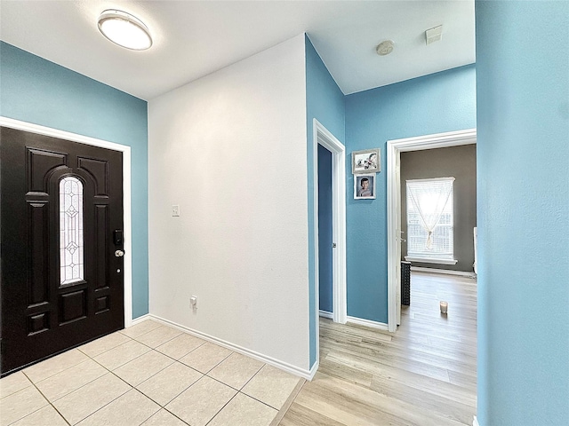 6468 Payton Dr, Fort Worth, TX 76131 - foyer entrance with baseboards and light wood-style flooring