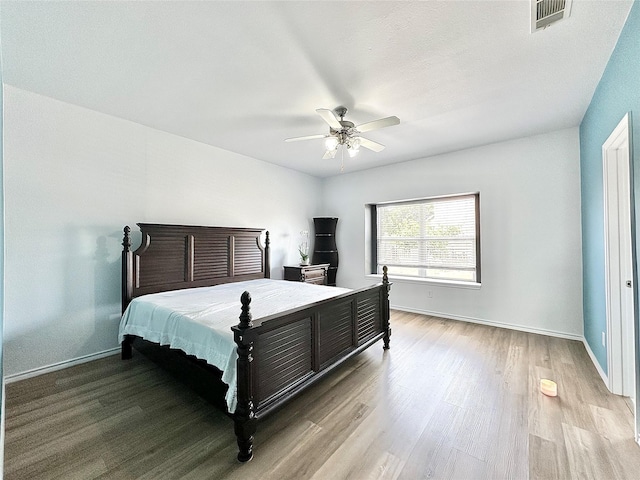 6468 Payton Dr, Fort Worth, TX 76131 - bedroom with wood finished floors, baseboards, and a ceiling fan