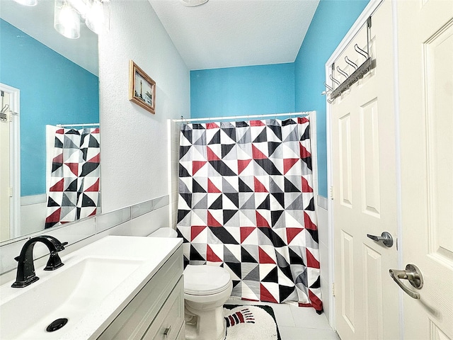6468 Payton Dr, Fort Worth, TX 76131 - bathroom with vanity, toilet, a shower with shower curtain, tile patterned flooring, and a textured ceiling