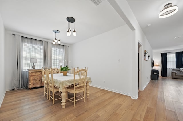 832 Garner Dr, Fate, TX 75087 - dining area with light wood-style flooring and baseboards