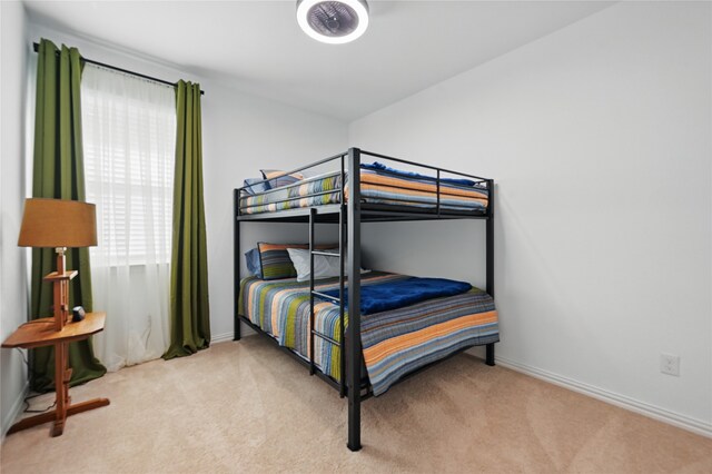 832 Garner Dr, Fate, TX 75087 - carpeted bedroom with baseboards