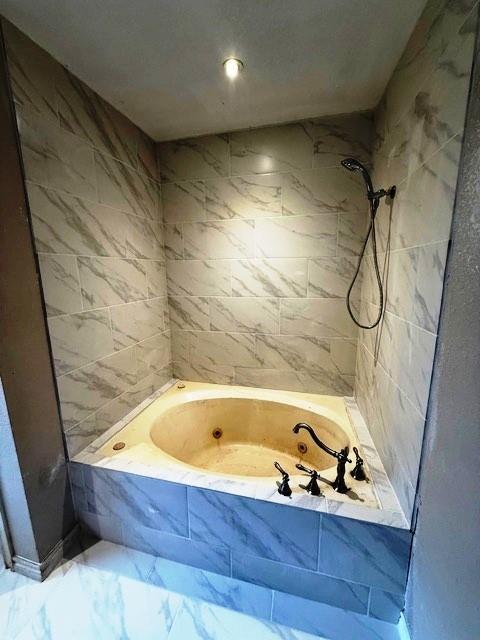 426 Gun Club Rd, Denison, TX 75021 - bathroom with marble finish floors, a bathtub, and tiled shower