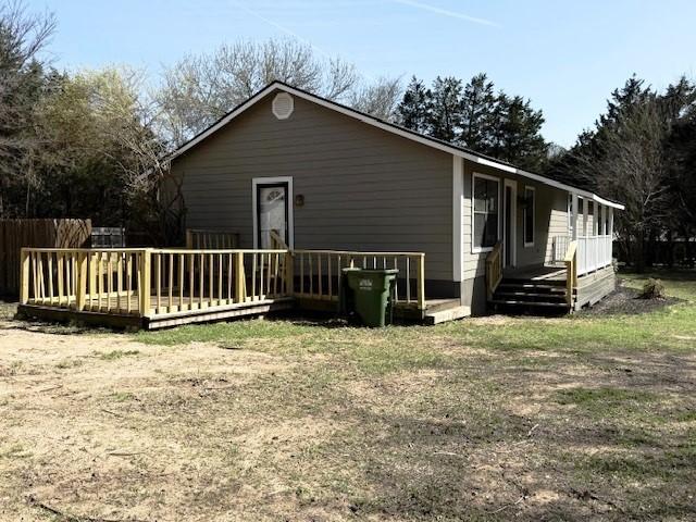 426 Gun Club Rd, Denison, TX 75021 - view of side of home with a wooden deck