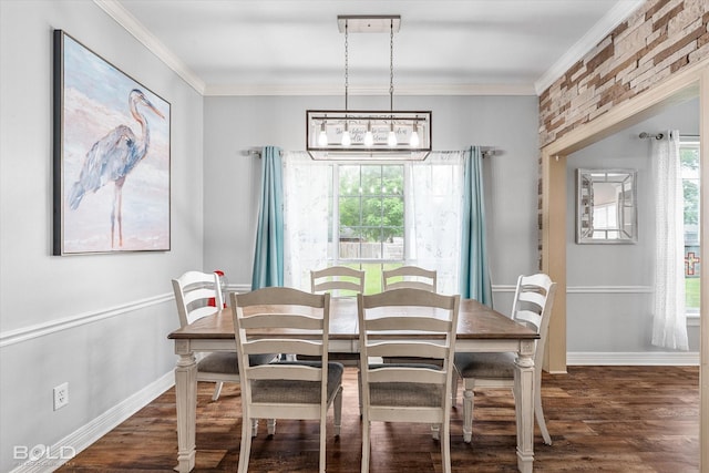 4013 Wisteria Ln, Benton, LA 71006 - dining room featuring dark wood-type flooring, a chandelier, baseboards, and ornamental molding