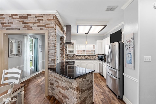 4013 Wisteria Ln, Benton, LA 71006 - kitchen featuring appliances with stainless steel finishes, range hood, dark wood-type flooring, tasteful backsplash, and crown molding