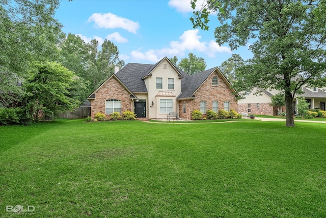 4013 Wisteria Ln, Benton, LA 71006 - traditional home featuring a chimney, roof with shingles, stucco siding, and brick siding